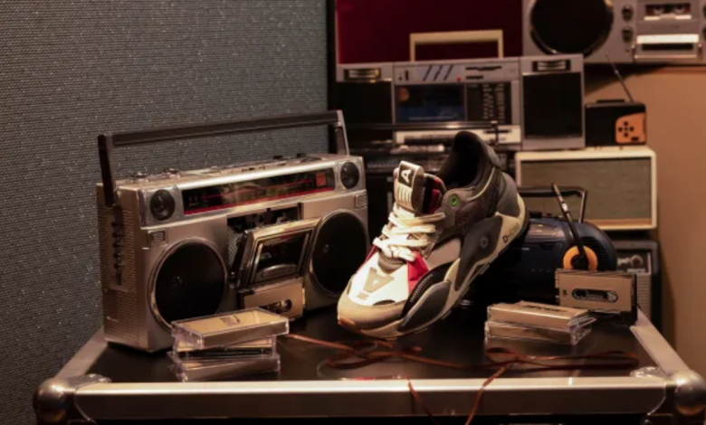 image of PUMA x Roc Nation sneakers near a record player
